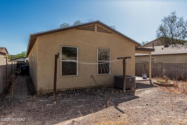 6399 S Sunrise Valley Dr, Tucson, AZ 85706 - rear view of property with central air condition unit and stucco siding