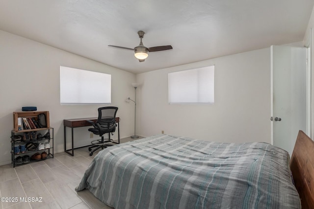 5809 E Rosewood St, Tucson, AZ 85711 - bedroom featuring a ceiling fan and baseboards