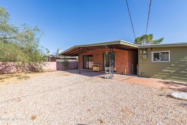 5809 E Rosewood St, Tucson, AZ 85711 - back of house with a patio area