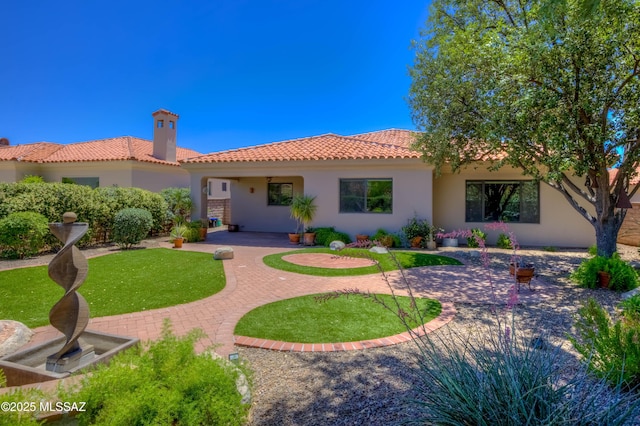7275 E Vuelta Rancho Mesquite, Tucson, AZ 85715 - rear view of property featuring stucco siding, a tiled roof, a patio area, a chimney, and a lawn
