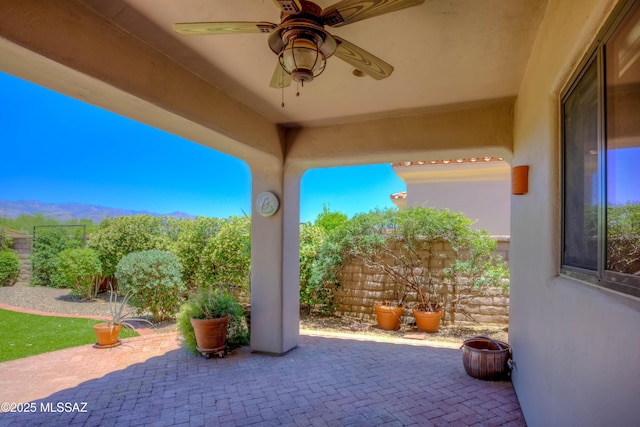 7275 E Vuelta Rancho Mesquite, Tucson, AZ 85715 - view of patio with a ceiling fan and a mountain view
