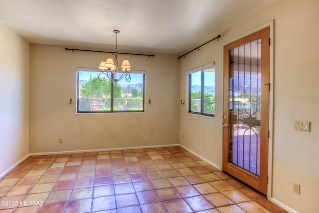 7275 E Vuelta Rancho Mesquite, Tucson, AZ 85715 - unfurnished dining area with a chandelier, baseboards, and light tile patterned floors