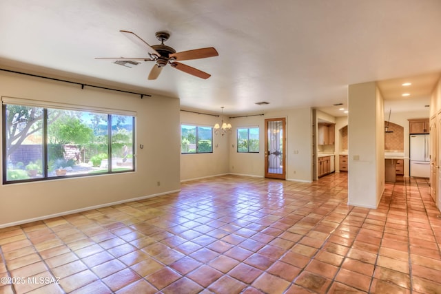 7275 E Vuelta Rancho Mesquite, Tucson, AZ 85715 - unfurnished room with a chandelier, baseboards, ceiling fan, recessed lighting, and light tile patterned floors