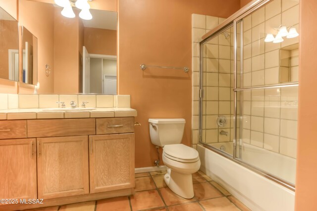 7275 E Vuelta Rancho Mesquite, Tucson, AZ 85715 - full bathroom with tile patterned floors, toilet, vanity, shower / bath combination with glass door, and baseboards