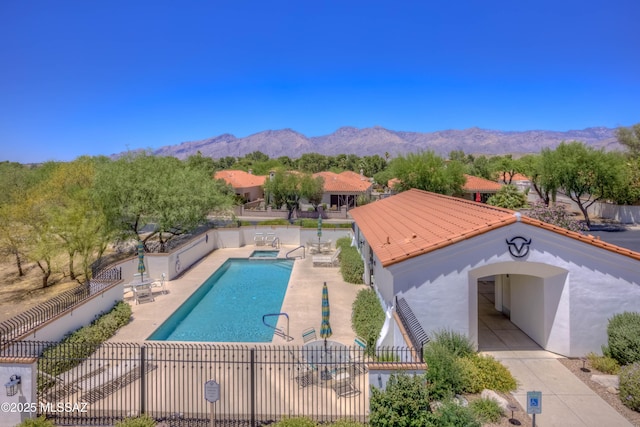 7275 E Vuelta Rancho Mesquite, Tucson, AZ 85715 - community pool with a mountain view and a patio