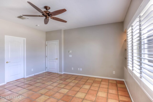 7275 E Vuelta Rancho Mesquite, Tucson, AZ 85715 - spare room featuring ceiling fan and baseboards