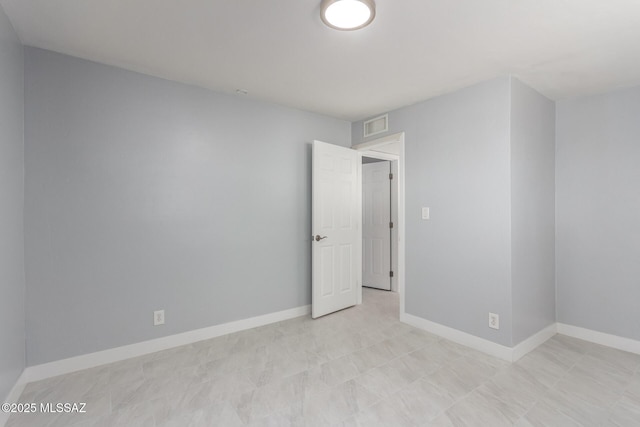 7909 E Beverly St, Tucson, AZ 85710 - empty room with baseboards
