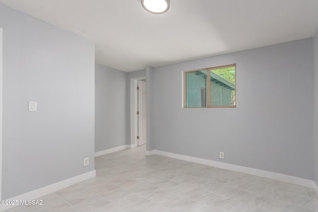 7909 E Beverly St, Tucson, AZ 85710 - unfurnished room with baseboards