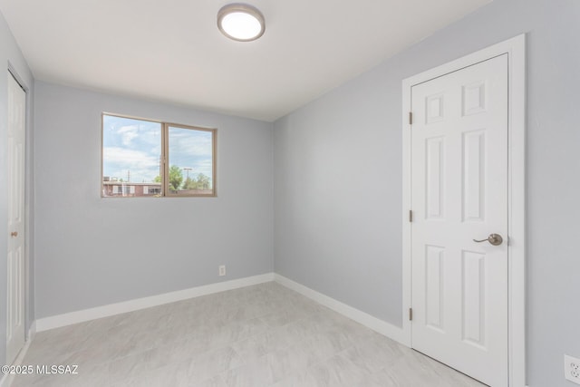 7909 E Beverly St, Tucson, AZ 85710 - unfurnished bedroom with baseboards