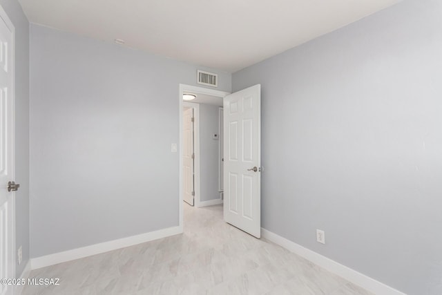 7909 E Beverly St, Tucson, AZ 85710 - empty room featuring baseboards