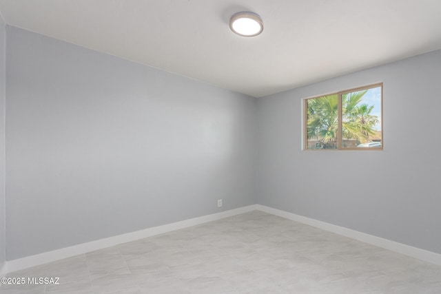 7909 E Beverly St, Tucson, AZ 85710 - empty room featuring baseboards