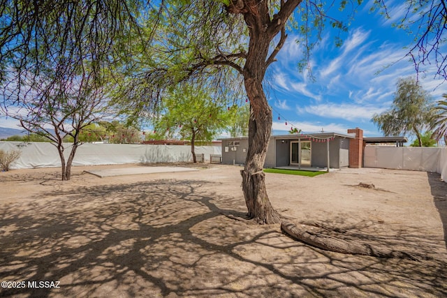 7909 E Beverly St, Tucson, AZ 85710 - fenced backyard featuring a patio area