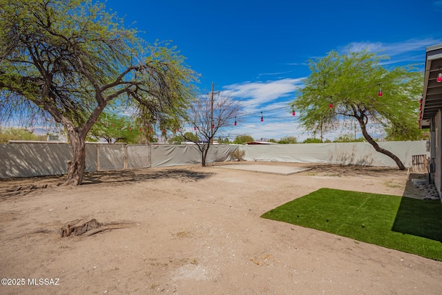 7909 E Beverly St, Tucson, AZ 85710 - fenced backyard with a patio area