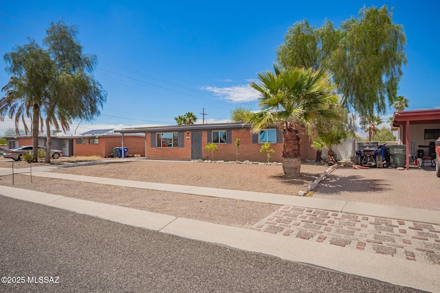 7909 E Beverly St, Tucson, AZ 85710 - ranch-style home with brick siding and driveway