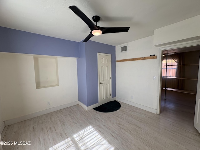 140 W 27th St, Tucson, AZ 85713 - unfurnished room with wood finished floors, baseboards, and ceiling fan