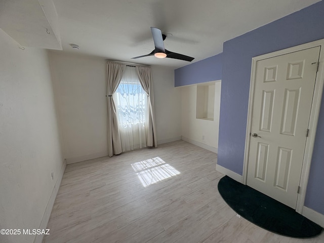 140 W 27th St, Tucson, AZ 85713 - unfurnished bedroom with light wood-style floors, baseboards, and a ceiling fan