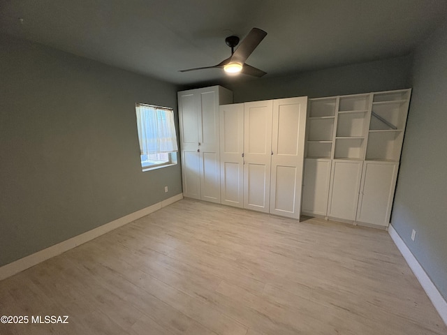 140 W 27th St, Tucson, AZ 85713 - unfurnished bedroom with baseboards, light wood-type flooring, and ceiling fan