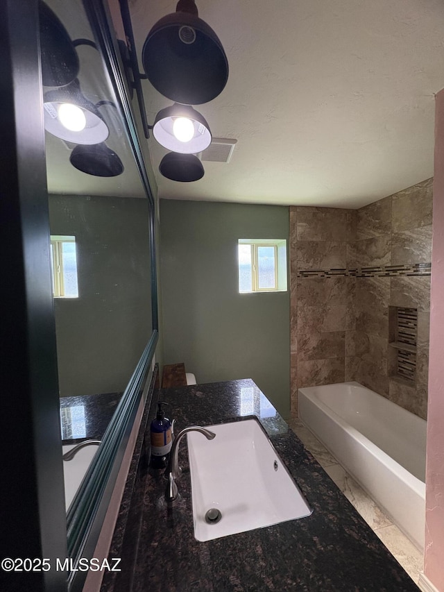 140 W 27th St, Tucson, AZ 85713 - full bathroom featuring a bathtub and a sink