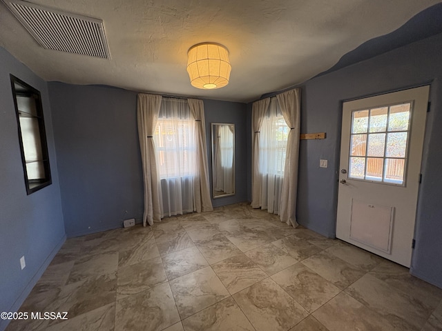 140 W 27th St, Tucson, AZ 85713 - entryway featuring baseboards