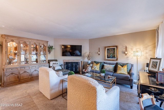 6255 N Camino Pimeria Alta Unit 22, Tucson, AZ 85718 - living area featuring light carpet and a tiled fireplace