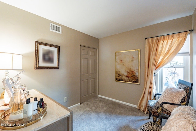 6255 N Camino Pimeria Alta Unit 22, Tucson, AZ 85718 - living area featuring carpet flooring and baseboards
