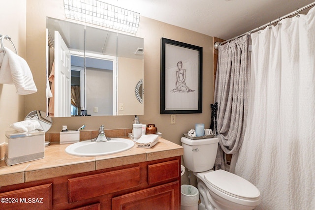6255 N Camino Pimeria Alta Unit 22, Tucson, AZ 85718 - bathroom featuring vanity, toilet, and a shower with curtain