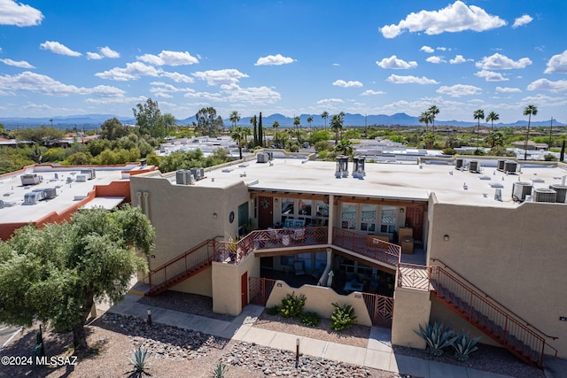 6255 N Camino Pimeria Alta Unit 22, Tucson, AZ 85718 - back of property with stairs, a mountain view, and central AC