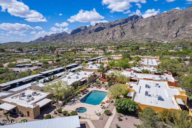 6255 N Camino Pimeria Alta Unit 22, Tucson, AZ 85718 - drone / aerial view of a pool and mountains