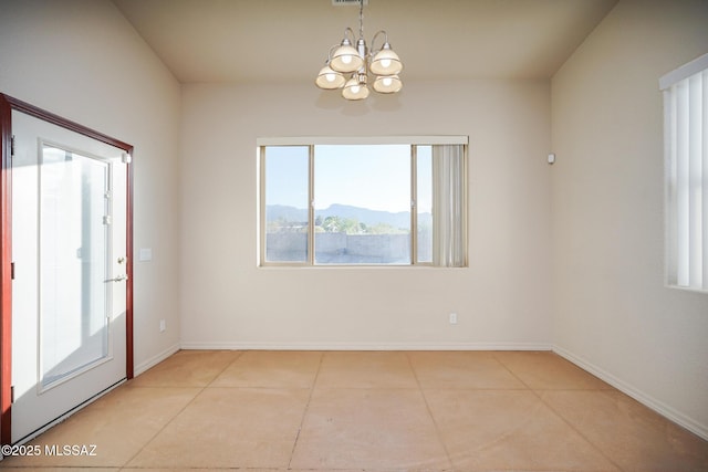 4210 S Santolina Ct, Sierra Vista, AZ 85650 - empty room featuring a chandelier, tile patterned flooring, a mountain view, and baseboards