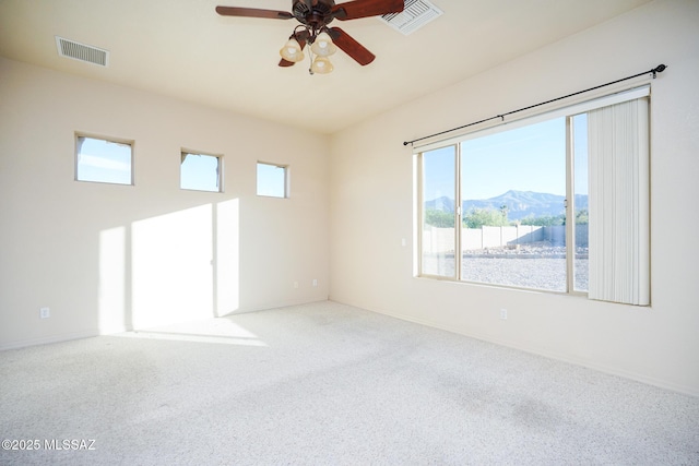 4210 S Santolina Ct, Sierra Vista, AZ 85650 - carpeted spare room featuring a mountain view, ceiling fan, and baseboards