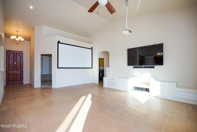 4210 S Santolina Ct, Sierra Vista, AZ 85650 - cinema room with light tile patterned floors, ceiling fan, arched walkways, a chandelier, and high vaulted ceiling
