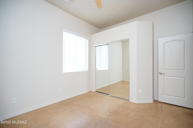 4210 S Santolina Ct, Sierra Vista, AZ 85650 - unfurnished bedroom with a closet, light tile patterned flooring, baseboards, and a ceiling fan