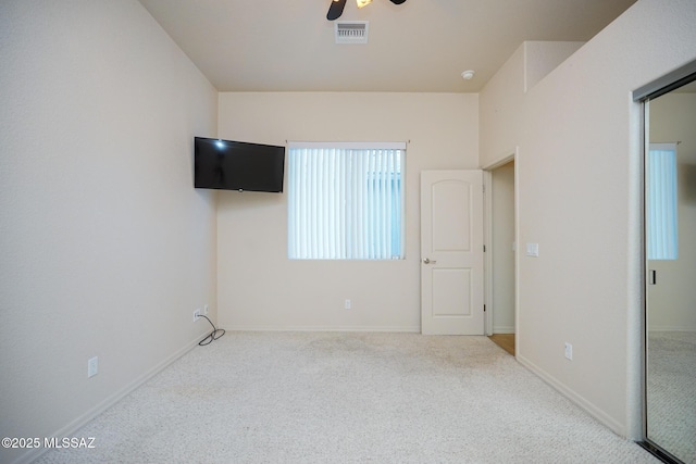 4210 S Santolina Ct, Sierra Vista, AZ 85650 - unfurnished bedroom featuring carpet flooring, multiple windows, a ceiling fan, and baseboards
