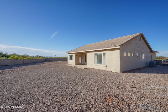 4210 S Santolina Ct, Sierra Vista, AZ 85650 - rear view of house with central air condition unit, a fenced backyard, a tile roof, stucco siding, and a patio