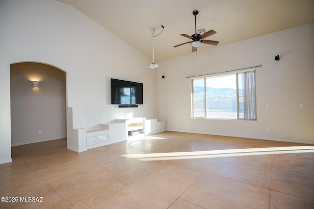 4210 S Santolina Ct, Sierra Vista, AZ 85650 - unfurnished living room with arched walkways, ceiling fan, high vaulted ceiling, and baseboards
