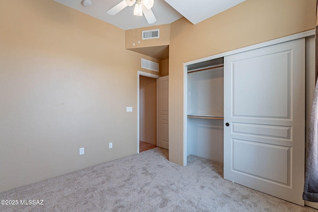 11315 N Mountain Meadow Pl, Oro Valley, AZ 85737 - unfurnished bedroom with light carpet, a closet, and ceiling fan