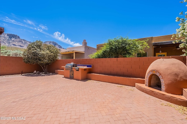 11315 N Mountain Meadow Pl, Oro Valley, AZ 85737 - fenced backyard featuring a patio and a mountain view