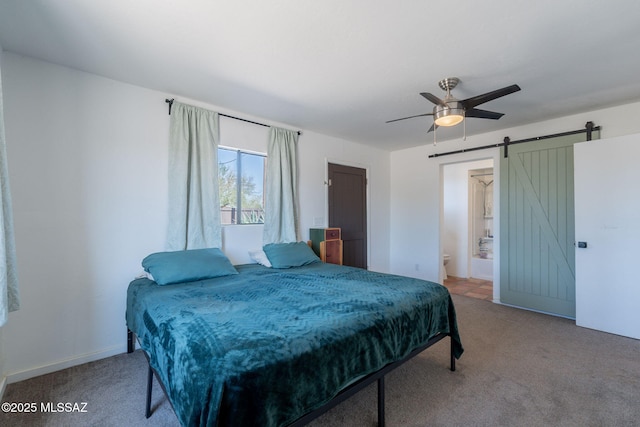 9845 N Volk Ave, Marana, AZ 85653 - carpeted bedroom with a barn door and ceiling fan