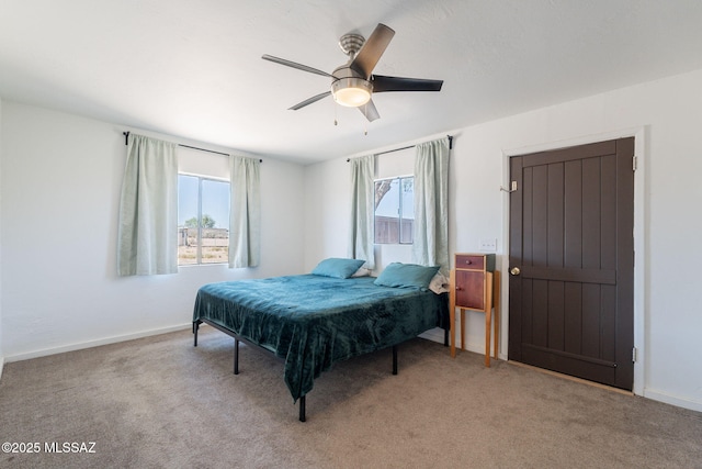 9845 N Volk Ave, Marana, AZ 85653 - bedroom with multiple windows, light colored carpet, and baseboards