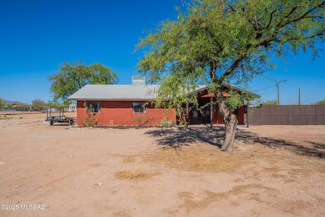 9845 N Volk Ave, Marana, AZ 85653 - back of house with a chimney