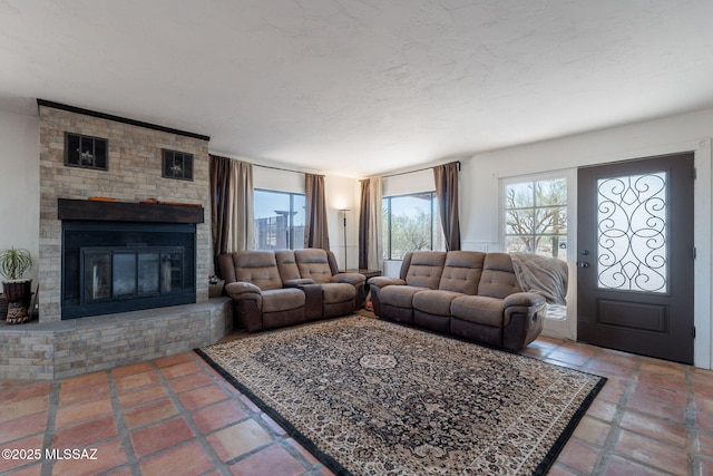 9845 N Volk Ave, Marana, AZ 85653 - living area featuring healthy amount of natural light and a fireplace