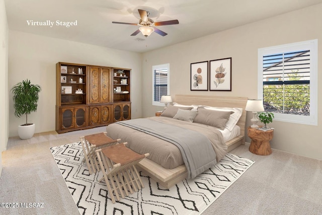 8880 W Blakebrook Rd, Marana, AZ 85653 - bedroom featuring multiple windows, carpet, and ceiling fan