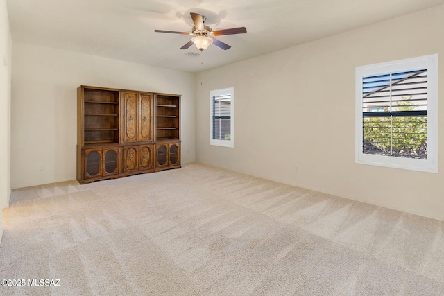 8880 W Blakebrook Rd, Marana, AZ 85653 - spare room featuring healthy amount of natural light, carpet, and a ceiling fan
