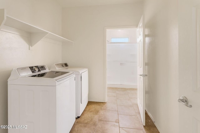 8880 W Blakebrook Rd, Marana, AZ 85653 - laundry room with washing machine and dryer and light tile patterned flooring