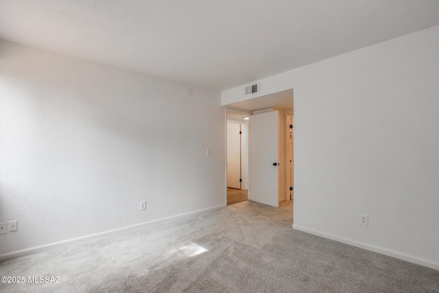 828 S Langley Ave Unit 101, Tucson, AZ 85710 - unfurnished room with light colored carpet and baseboards