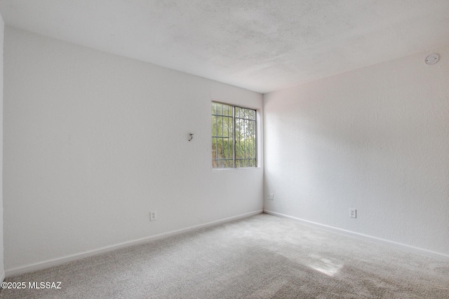 828 S Langley Ave Unit 101, Tucson, AZ 85710 - unfurnished room featuring a smoke detector, carpet flooring, and baseboards