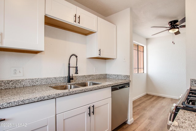 828 S Langley Ave Unit 101, Tucson, AZ 85710 - kitchen featuring appliances with stainless steel finishes, a sink, light wood-style floors, and white cabinetry