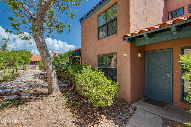 5357 N Paseo De La Terraza, Tucson, AZ 85750 - doorway to property featuring stucco siding and a tiled roof
