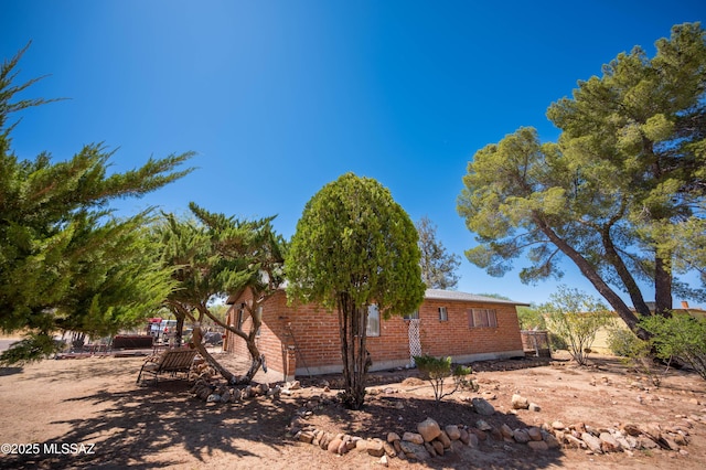 517 Kino Springs Dr, Nogales, AZ 85621 - view of side of property with brick siding