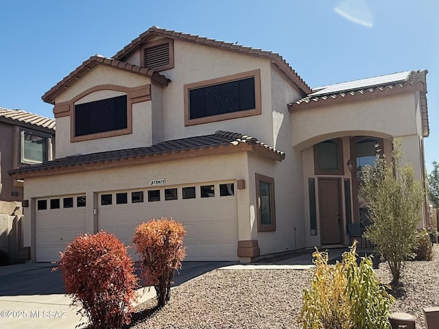 15415 S Camino Agua Azul, Sahuarita, AZ 85629 - view of front of house featuring a garage, a tile roof, concrete driveway, and stucco siding
